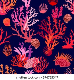 Magic undersea world. Seamless vector pattern with colorful corals. Beach textile collection.  Red, pink on dark blue.