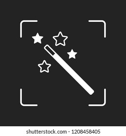 magic wand with stars. simple silhouette. White object in camera autofocus on dark background