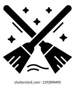 Magical brooms solid icon design 