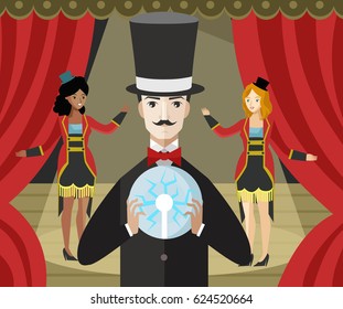 magician with magic trick electric ball on stage with assistants