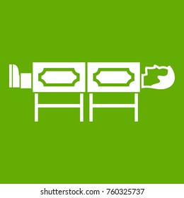Magician sawing box icon white isolated on green background. Vector illustration
