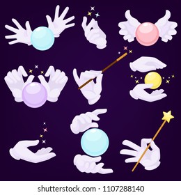Magicians hands in white gloves with magic ball and wand