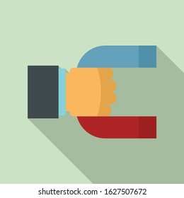 Magnet in hand icon. Flat illustration of magnet in hand vector icon for web design