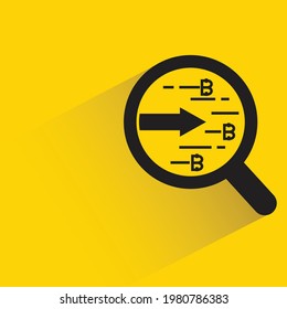 magnifier glass and bitcoin con with shadow on yellow background