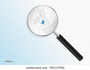 Magnifier with map of Wales on abstract topographic background. Vector map.