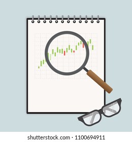 Magnifying glass and business notebook and work place.