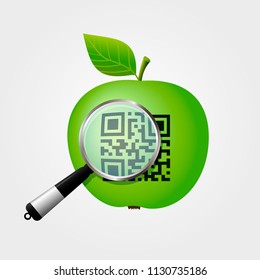 Magnifying glass checking QR-code on green apple