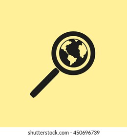 Magnifying glass with a globe. 