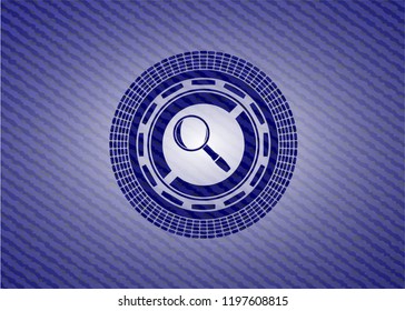 magnifying glass icon inside badge with jean texture