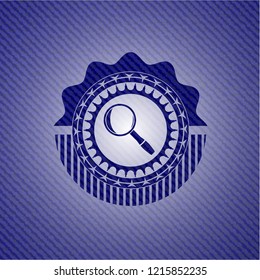 magnifying glass icon inside badge with denim background