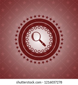 magnifying glass icon inside badge with red background