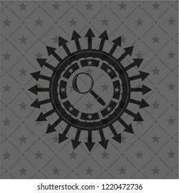 magnifying glass icon inside black emblem