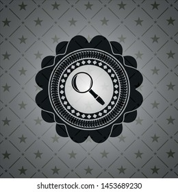 magnifying glass icon inside black badge