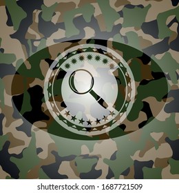 magnifying glass icon inside camo texture