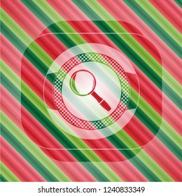 magnifying glass icon inside christmas colors emblem.