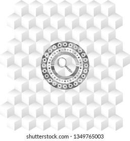 magnifying glass icon inside grey icon or emblem with geometric cube white background