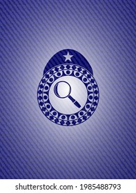 magnifying glass icon inside jean background. 