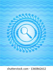 magnifying glass icon inside light blue water emblem background.