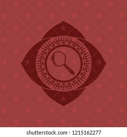 magnifying glass icon inside red emblem