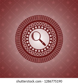 magnifying glass icon inside red icon or emblem