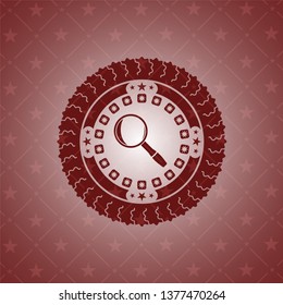 magnifying glass icon inside red icon or emblem