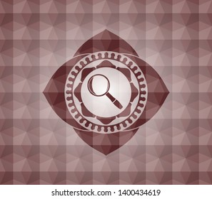magnifying glass icon inside red seamless emblem with geometric pattern.