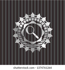 magnifying glass icon inside silver shiny emblem