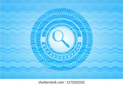 magnifying glass icon inside sky blue water badge background.