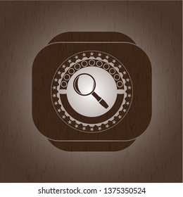 magnifying glass icon inside vintage wooden emblem