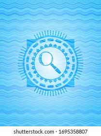 magnifying glass icon inside water wave concept style badge.