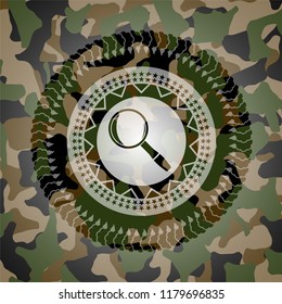 magnifying glass icon on camo texture