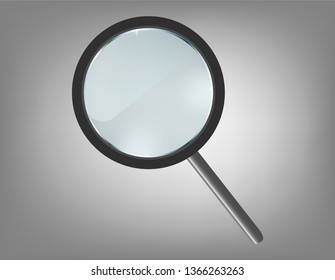Magnifying glass on gray background.