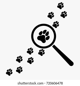 Magnifying glass and paw prints.  Vector illustration.