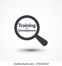 Magnifying glass with words training and development on white background