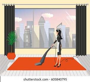 Maid cleans the carpet in the hotel room with a vacuum cleaner
