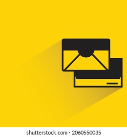 mail and envelope with shadow on yellow background