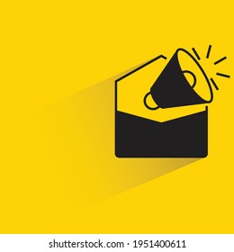 mail marketing and megaphone with shadow on yellow background