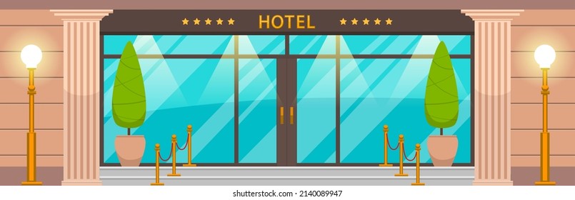 Main front entrance to luxury hotel. Decorative elements in front of main door of large building. Entrance to five-star hotel with glass doors. Exterior and facade of modern residential building