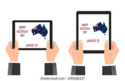 The mainland of Australia, in the colors of the Australian flag, is depicted in mobile devices that are held in their hands. Festive day of Australia. January 26