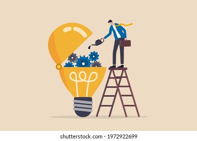 Maintenance brain to generate idea or creativity and innovation to invent new business ideas concept, businessman drop lubricant or grease into open lightbulb lamp with mechanical gears.