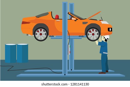 Maintenance technician is working to check the engine car. Lifting machine for easy checking In the maintenance shop.