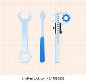 Maintenance tools screwdriver, spanner and caliper on drawing paper
