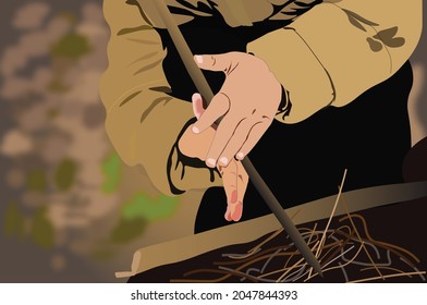 Make a fire in field without a match. Survivalist hands twist twigs to make fire starter