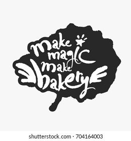 Make Magic Make Bakery. Hand written calligraphy phrase in an ink blot. White on black. Clipping paths included.