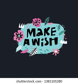 Make a wish flat hand drawn lettering. Birthday vector greeting card. Handwritten text in speech cloud. Black cartoon letters collage in floral frame. Poppies and camomiles illustration for scrapbook