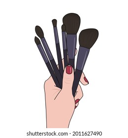 Make-up-Bürsten in der Hand auf weißem Hintergrund, Vektorgrafik.