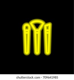 Makeup Brushes yellow glowing neon ui ux icon. Glowing sign logo vector