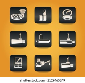 make-up products symbols on black buttons on yellow background