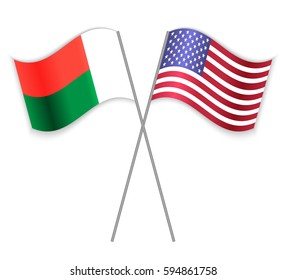 Malagasy and American crossed flags. Madagascar combined with United States of America isolated on white. Language learning, international business or travel concept.