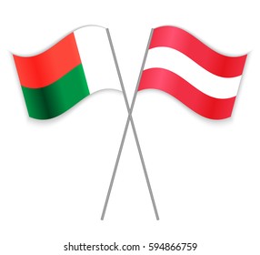 Malagasy and Austrian crossed flags. Madagascar combined with Austria isolated on white. Language learning, international business or travel concept.
